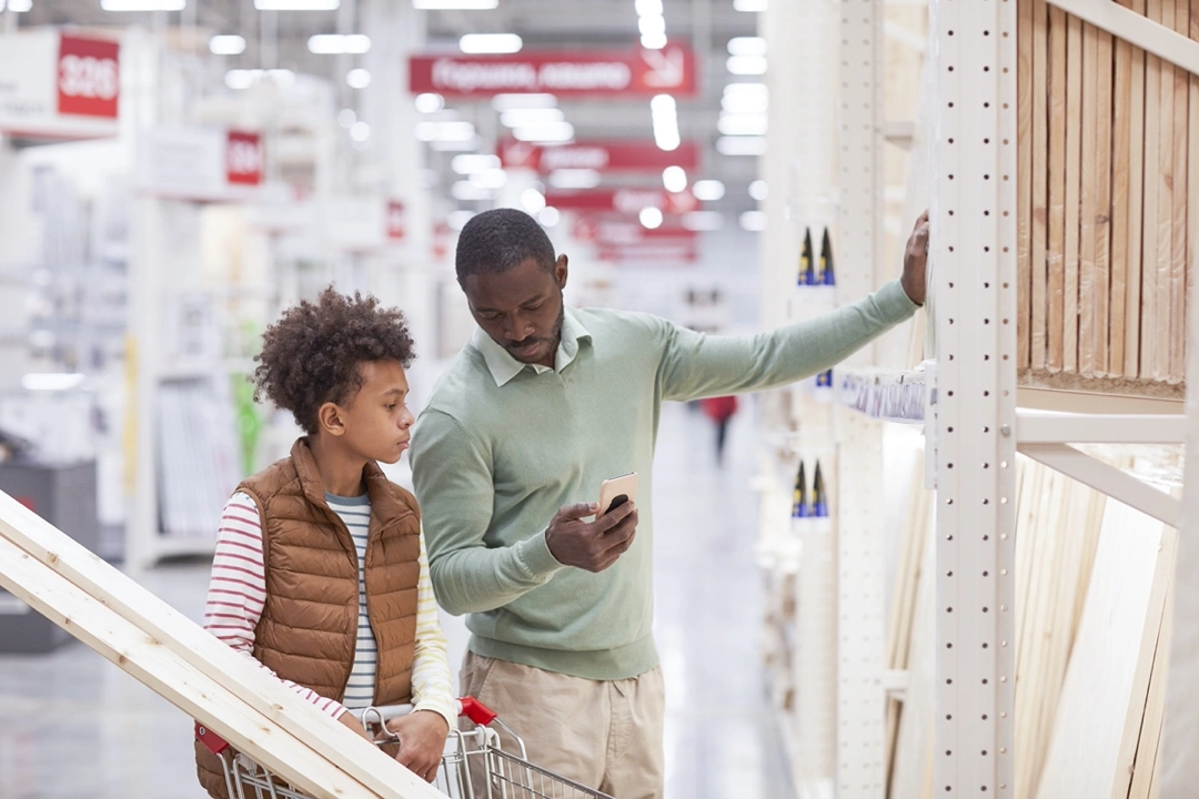 A father and son choosing the right materials to install a door.